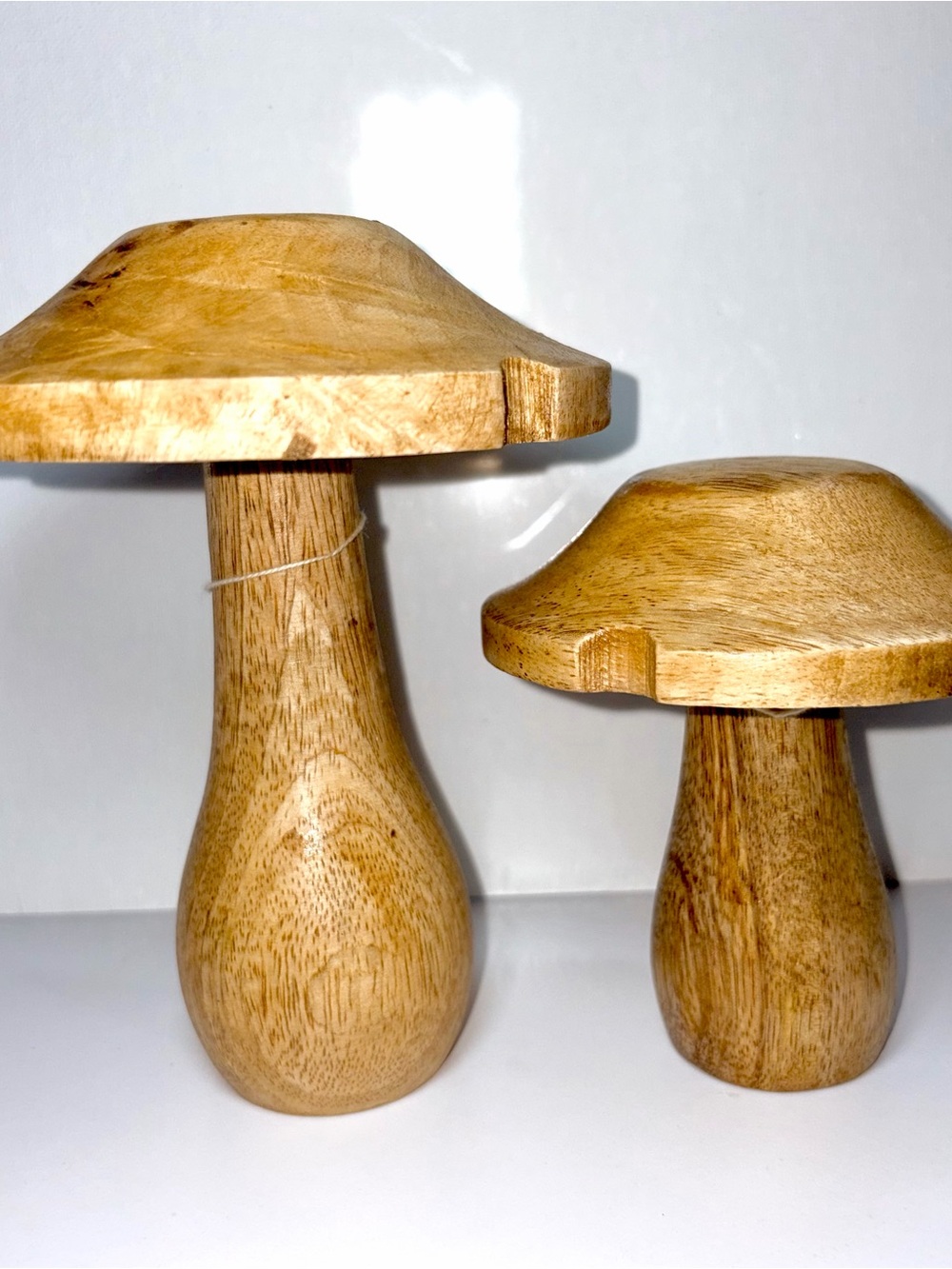 hand-carved wooden mushroom sculptures